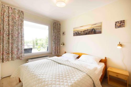Postel nebo postele na pokoji v ubytování ROD32e "Carpe Diem" Ferienwohnung Schönberg