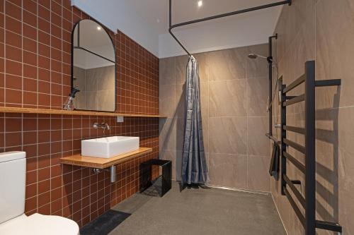 a bathroom with a toilet and a sink at Woodside Bed and Breakfast in Greytown