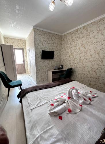 TV a/nebo společenská místnost v ubytování UMAR Hotel