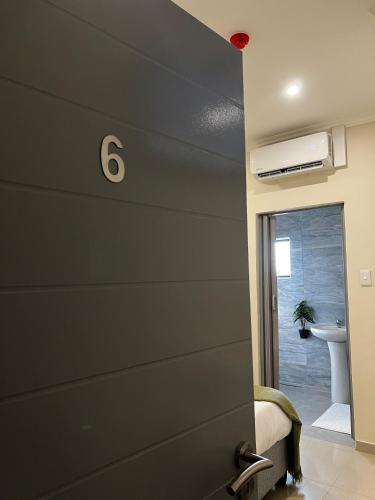 a room with a wall with the number on it at Montrose BnB in Margate