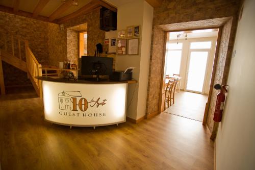 a guest house with a counter in a room at Guest House 10 de Agosto in Figueira da Foz