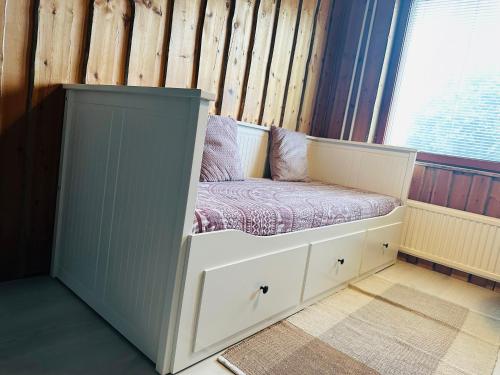 a childs bed in a room with a window at Your home away from home! in Rovaniemi