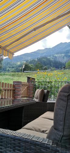 a patio with a view of a field of flowers at Ferienwohnung Die Möll in Latzendorf
