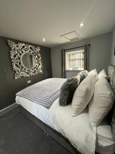 a bedroom with a bed with two stuffed animals on it at Stepping Stones Cottage in Lealholm