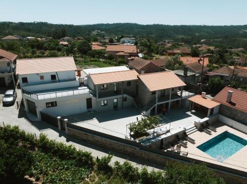 an aerial view of a house with a swimming pool at Ahcor Housing - Quinta do Paço in Figueiredo de Alva