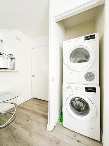 a laundry room with a washer and dryer at Charming 2-BR, 2-Story Retreat in Heart of LA - BR4 in Los Angeles
