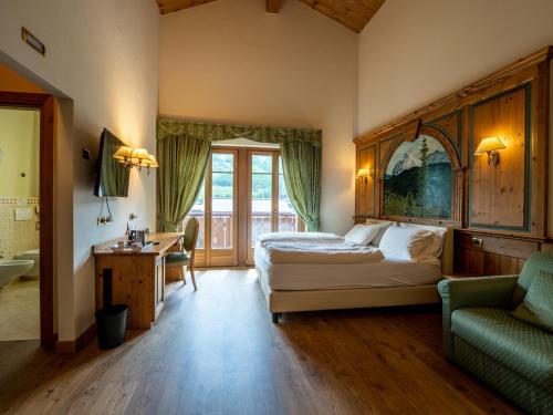 Postel nebo postele na pokoji v ubytování Hotel Cervo