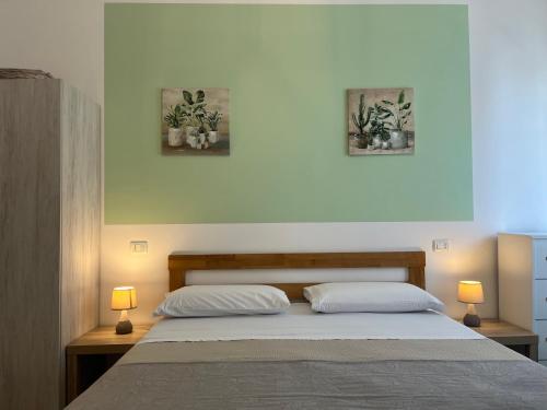 Ένα ή περισσότερα κρεβάτια σε δωμάτιο στο B&B Vento Aureo Rooms