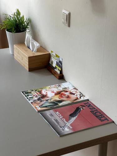 a magazine sitting on top of a table at Het Huis van Bewustzijn in Limmen