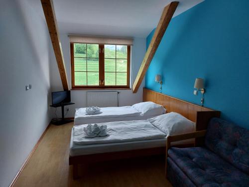 Postel nebo postele na pokoji v ubytování Hotel Gold