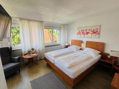 Postel nebo postele na pokoji v ubytování Hotel Hiltruper Hof