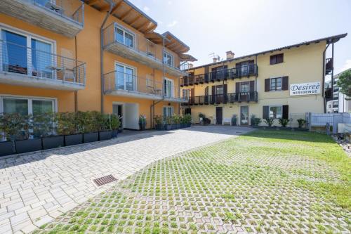 an empty courtyard in front of a building at Residence Desiree in Riva del Garda