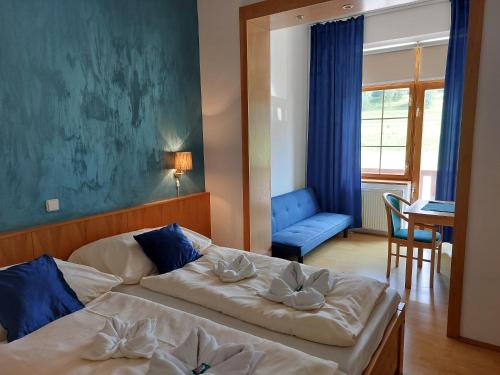 Posteľ alebo postele v izbe v ubytovaní Hotel Gold
