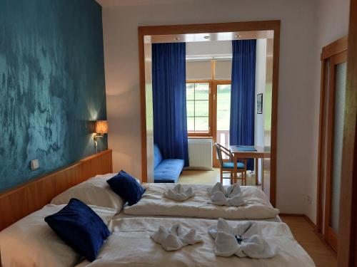 Posteľ alebo postele v izbe v ubytovaní Hotel Gold