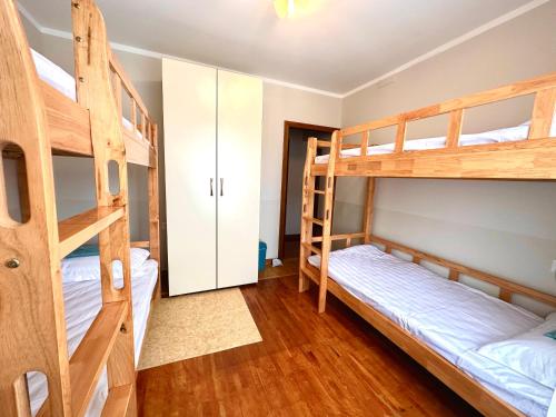 a bunk bed room with two bunk beds at Amar Guest House in Ulaanbaatar