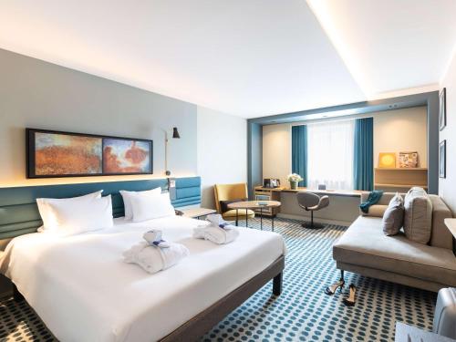Postel nebo postele na pokoji v ubytování Novotel Luxembourg Kirchberg