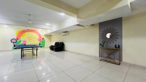 a room with a table and a painting on the wall at BluO Studio5 Golf Course Road - Gym, Terrace Garden in Gurgaon