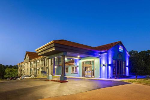 a large building with blue lights on it at Baymont by Wyndham Branson Thousand Hills in Branson