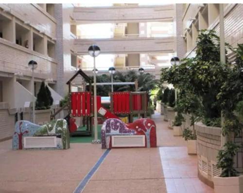 a mall with a playground in the middle of a building at Apartamento en Marina Trébol III, centro de Mágic World in Oropesa del Mar