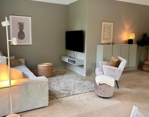 TV o dispositivi per l'intrattenimento presso Ferienwohnung Clemens, neue Wohnung zentral und hochwertig