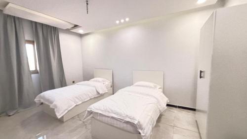 เตียงในห้องที่ المسك للوحدات الفندقيه الفاخره