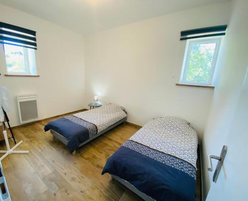 Postel nebo postele na pokoji v ubytování La Grande Escale des Brias