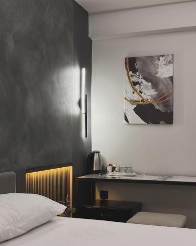 a bedroom with a bed and a counter with a sink at Medi Otel in Samsun
