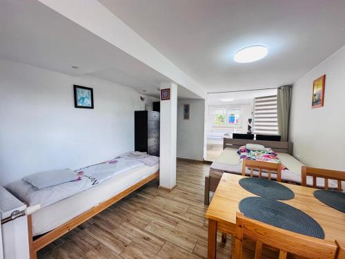 Ένα ή περισσότερα κρεβάτια σε δωμάτιο στο Apartament Bukowy
