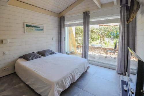 Ένα ή περισσότερα κρεβάτια σε δωμάτιο στο Lodge Terre de Glisse