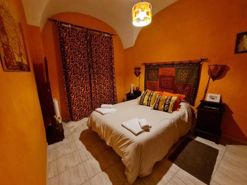 Postel nebo postele na pokoji v ubytování Las Cuatro Esquinas de Cáceres