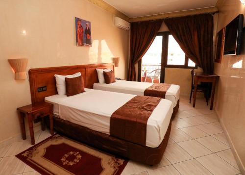 Ένα ή περισσότερα κρεβάτια σε δωμάτιο στο Hotel Majorelle