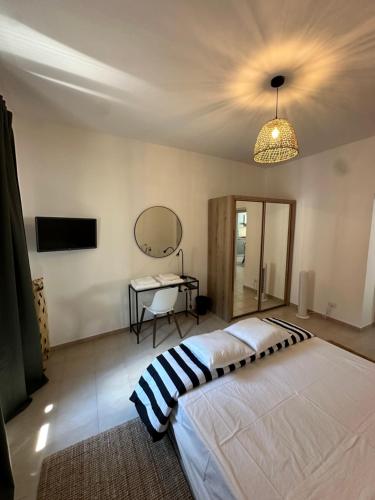 a bedroom with a large bed and a desk at Clarissa Guest House via di Mezzo 194 in Rieti