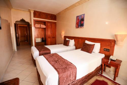Postel nebo postele na pokoji v ubytování Hotel Majorelle