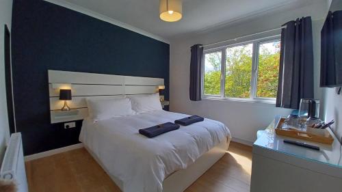 Ένα ή περισσότερα κρεβάτια σε δωμάτιο στο Gynack Villa