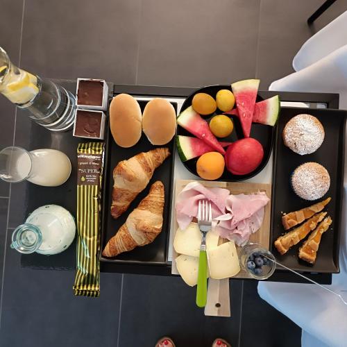 a tray with different types of food on it at Corte Giorgi in Breno