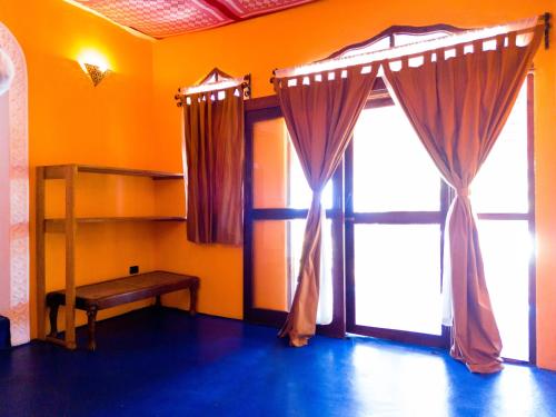 a room with a bunk bed and a window at Swahili Palace Zanzibar in Pwani Mchangani