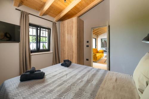 Giường trong phòng chung tại Casa Al Lavere 2363