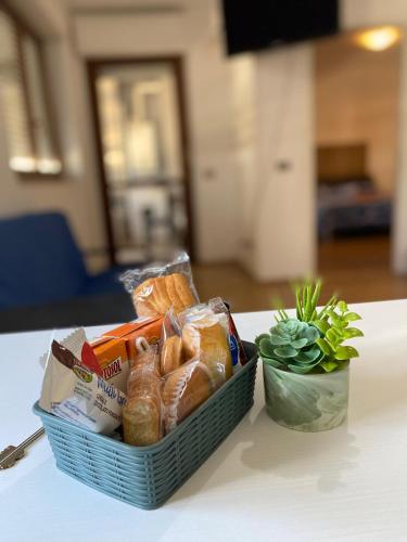 a basket of food sitting on a table at Casa CHANEL in Latina