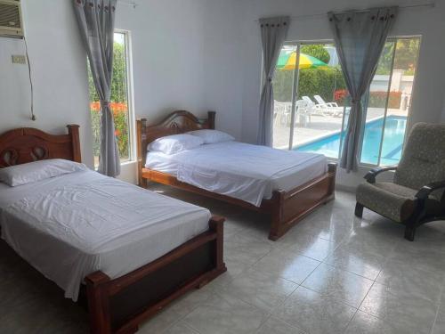 En eller flere senge i et værelse på Casa campestre en Melgar