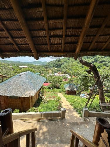 a view of a village from inside a hut at Alta-Cabana in El Nido