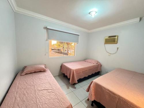 Ένα ή περισσότερα κρεβάτια σε δωμάτιο στο Privé das Thermas II - Via Caldas