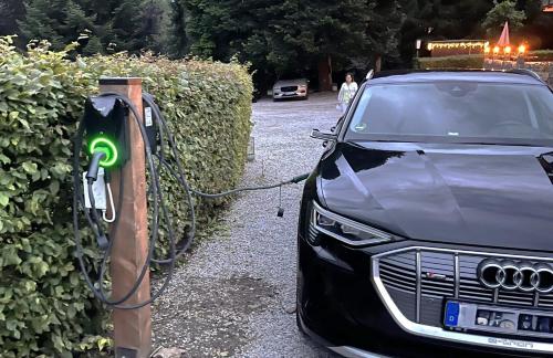 a car is plugged into a electric car charger at Harz hotel Iris in Sieber