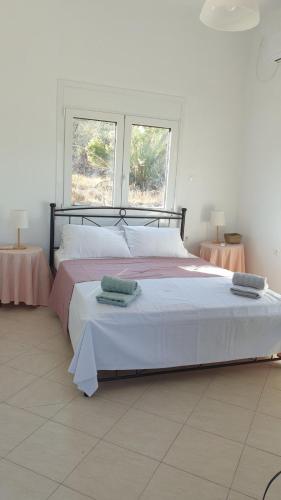 Ένα ή περισσότερα κρεβάτια σε δωμάτιο στο Vasso Galati House