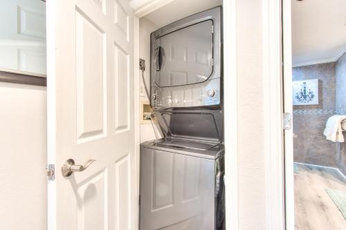 a microwave sitting on top of a refrigerator at Sand Key South Beach Condo 601 in Clearwater Beach
