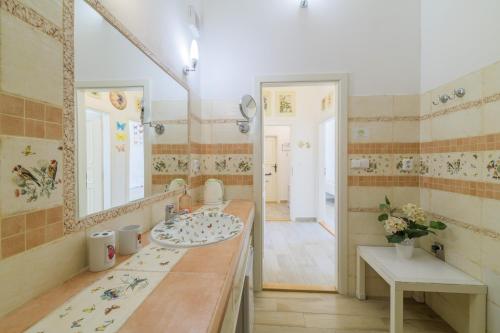 a bathroom with a sink and a mirror at Penzion U Zámku in Mělník