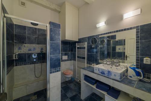 a bathroom with a sink and a shower at Penzion U Zámku in Mělník
