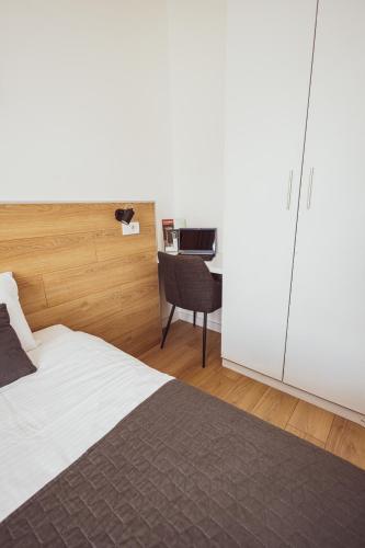 Una cama o camas en una habitación de BG Exclusive Suites