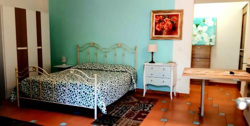 a bedroom with a bed with a leopard print bedspread at Villa Margot in Agropoli