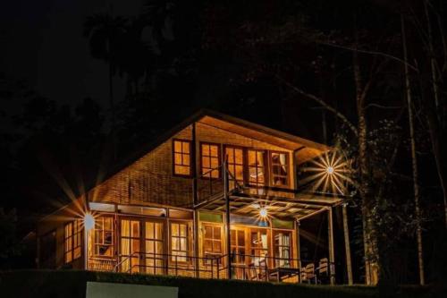 a large house at night with its lights on at Chiewlan Camp and Resort in Ban Pha Saeng Lang