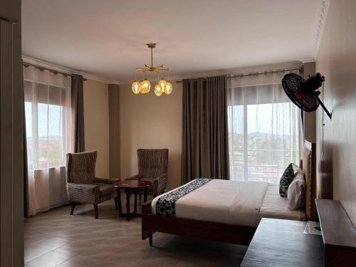 Postel nebo postele na pokoji v ubytování Starview Hotel Kampala